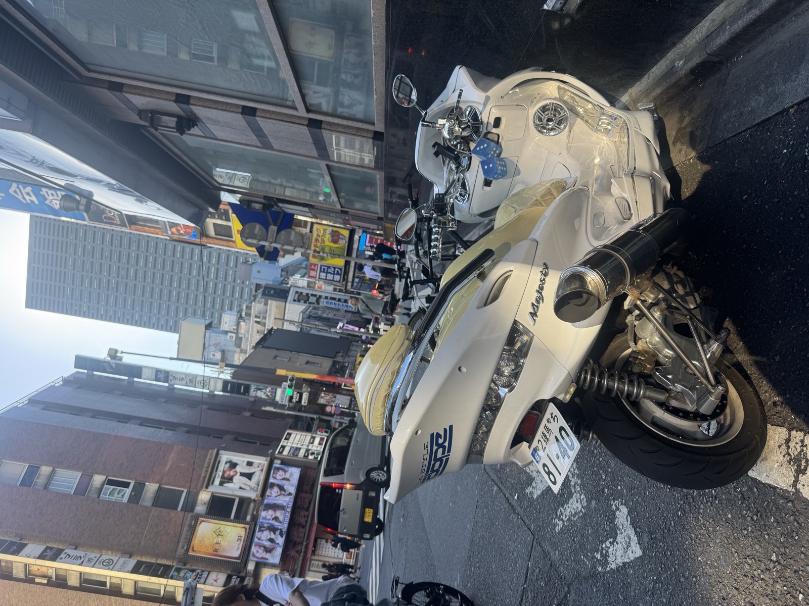 A customised scooter parked on a Shinjuku side street.
