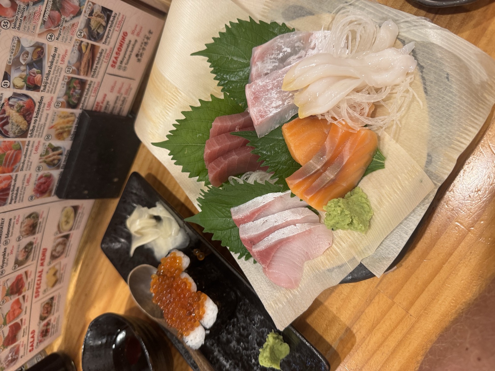 A fresh sashimi platter at a market restaurant.