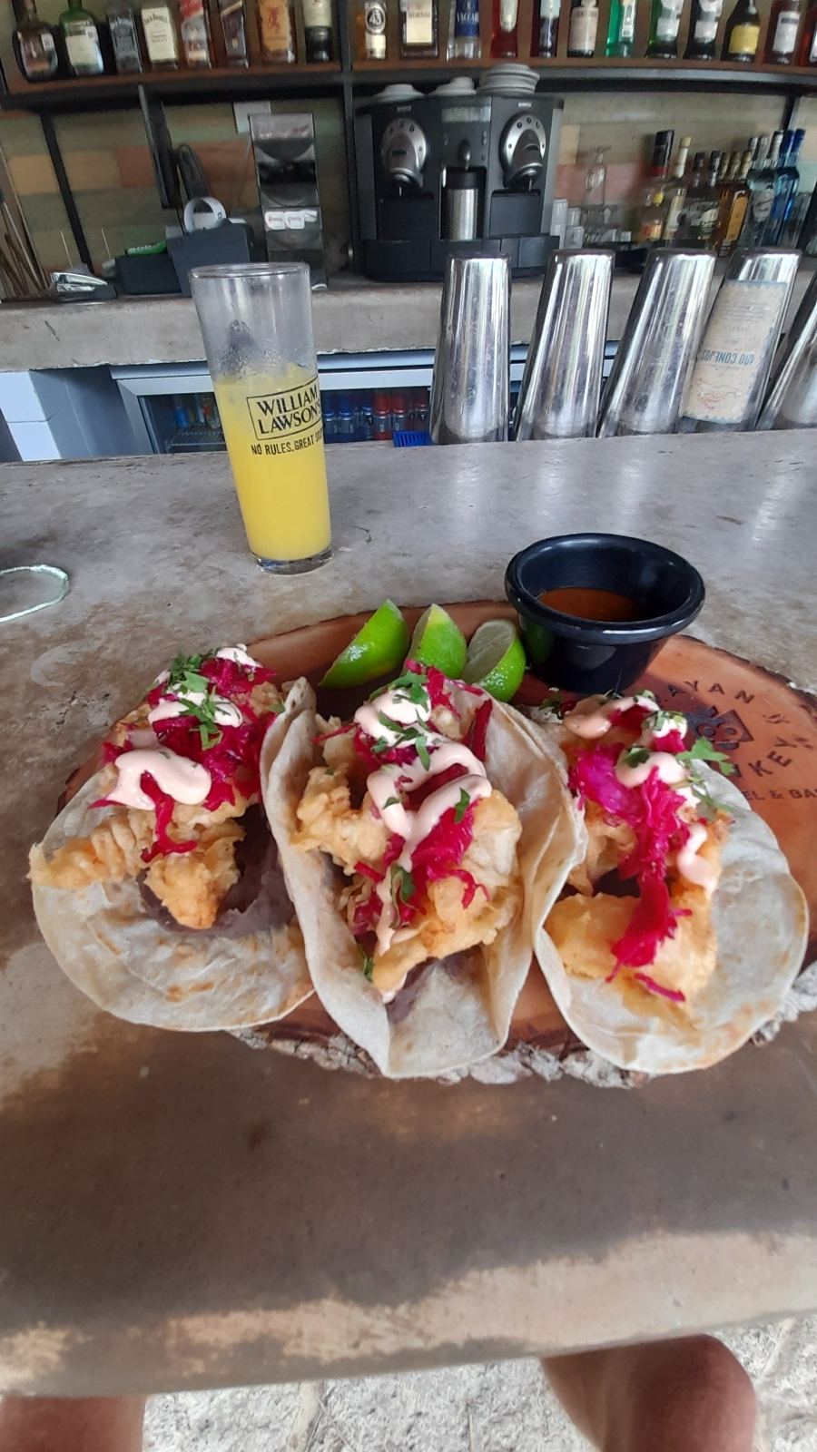 Fish tacos with pickled cabbage and chipotle crema at a beach bar in the Riviera Maya.