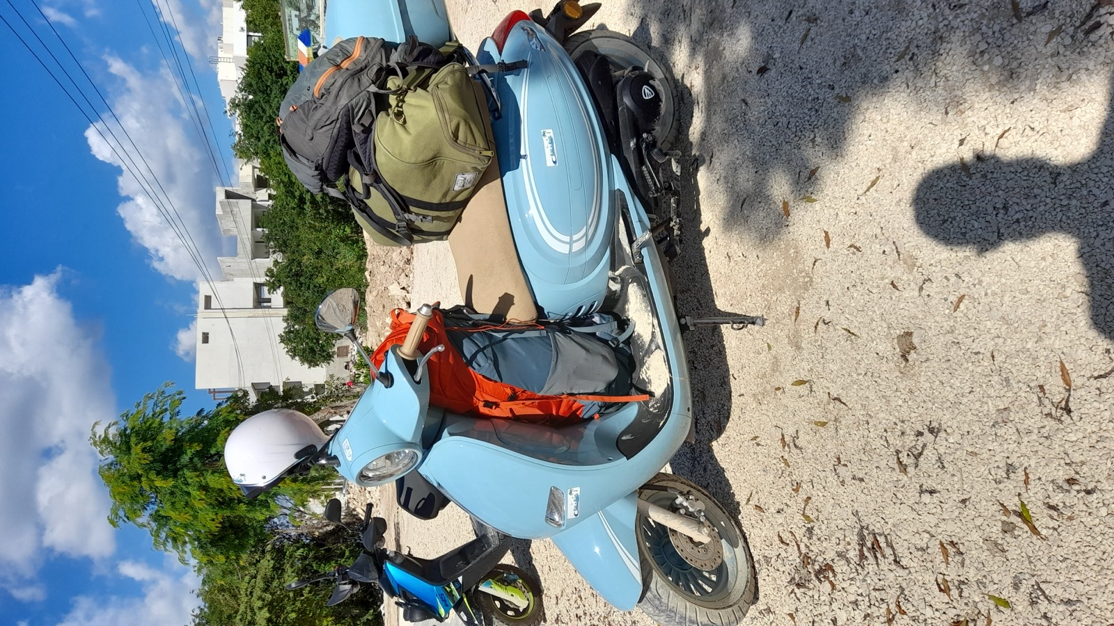 A rental scooter loaded up for a day trip around Tulum.